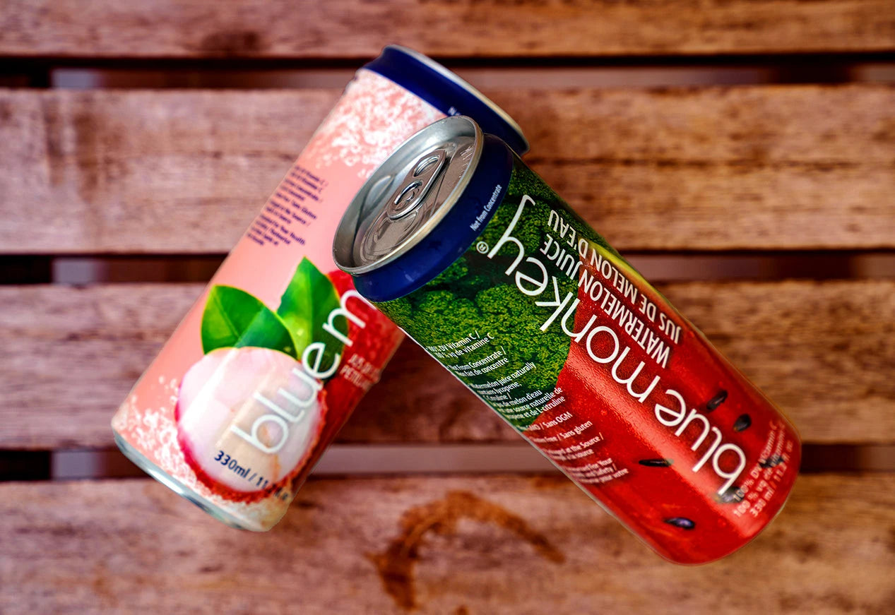 Sparkling Juice cans on wood table